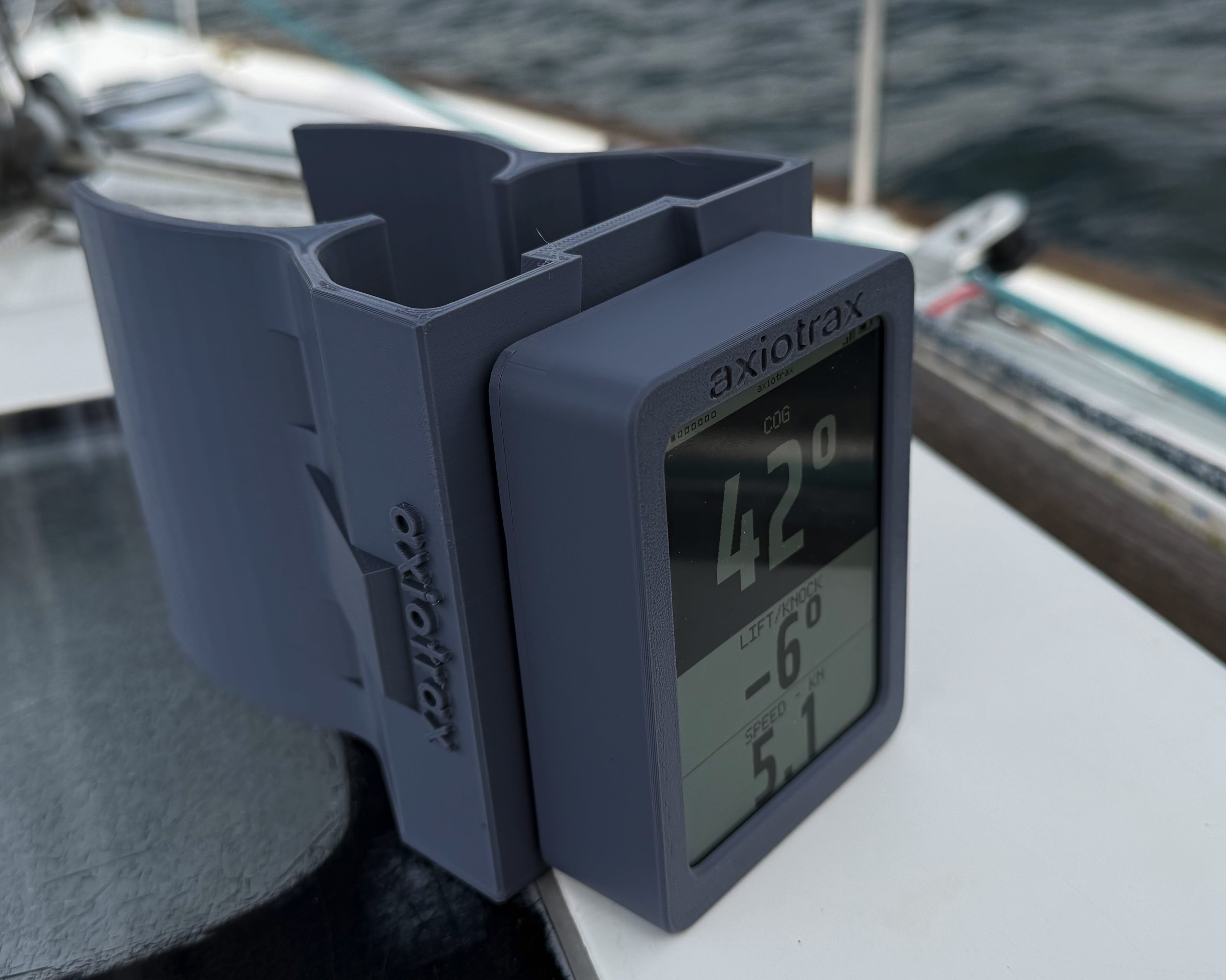 The axiotrax display on a mast bracket, angled toward the cockpit