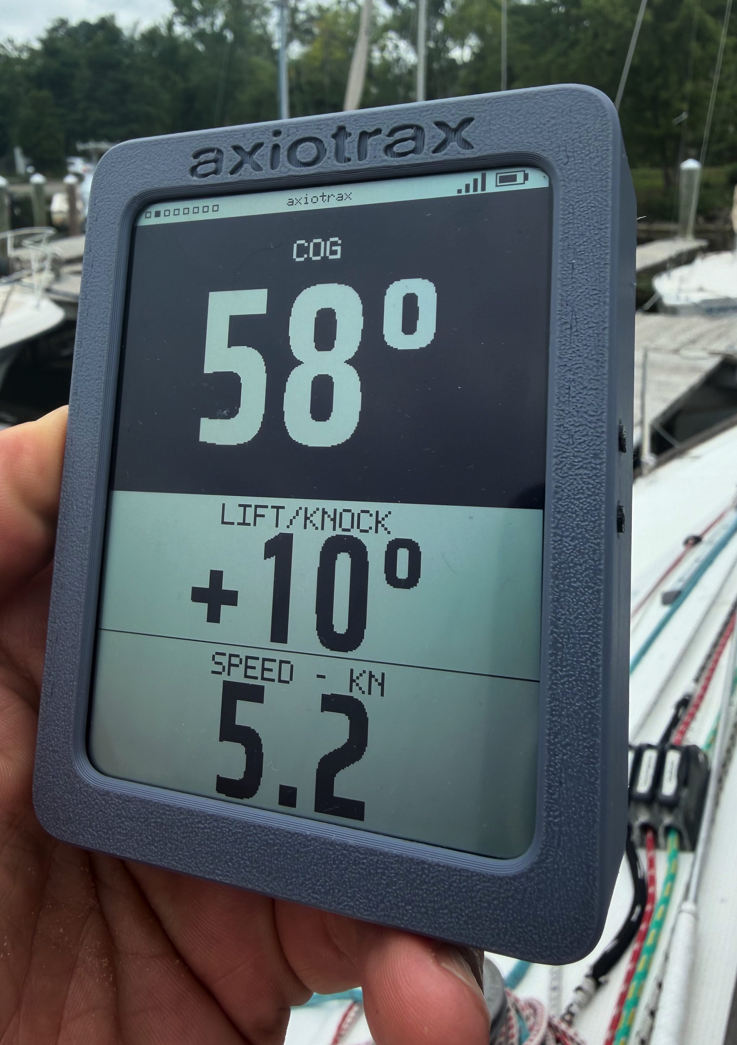 The axiotrax display showing speed and target numbers on a reflective screen